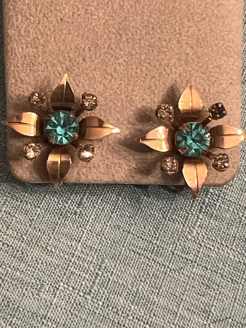 Vintage Prestige gold tone flower screw back earrings with blue stone